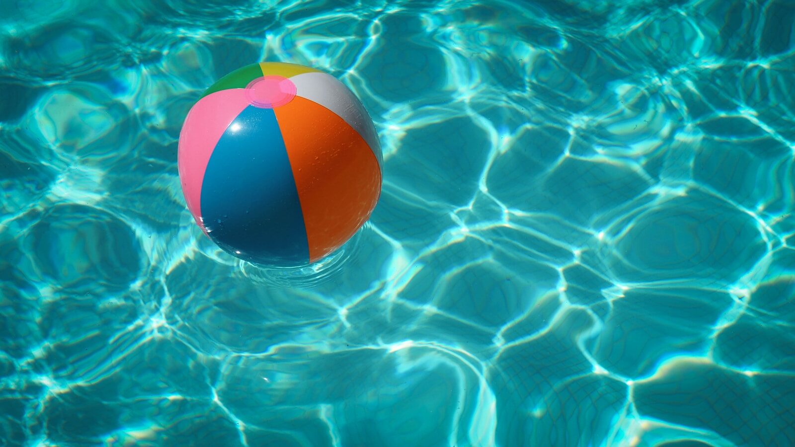 Photo by Raphaël Biscaldi white and multicolored beach ball